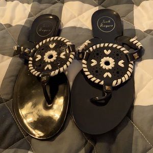 A pair of Jack Rogers black jelly sandals